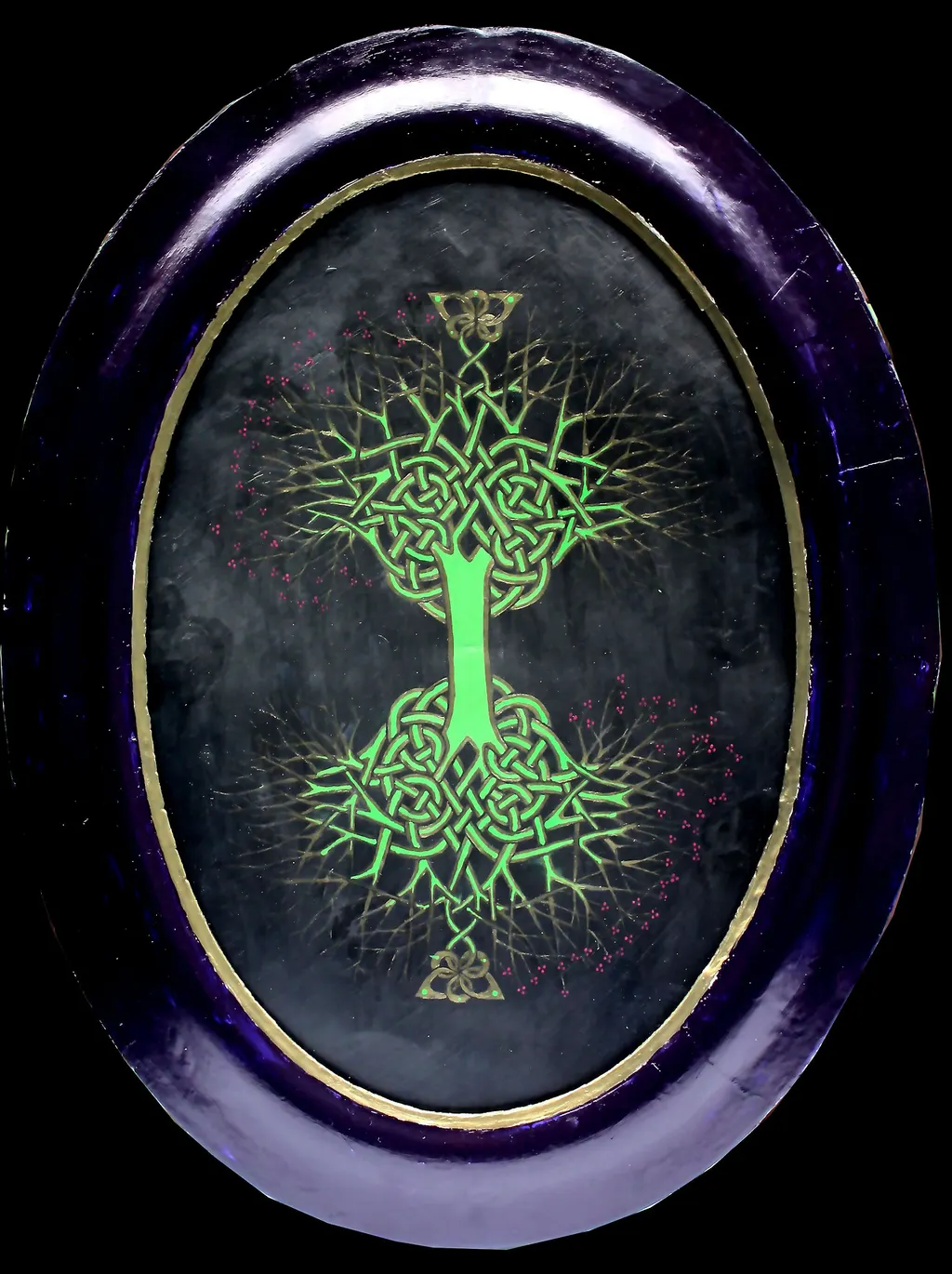 A celtic tree of life on a black oval